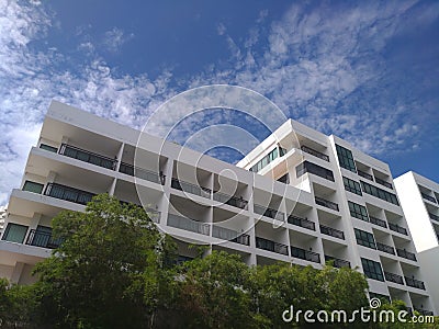 The large building with blue sky cloud and tree Stock Photo