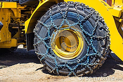Large Bulldozer Tire With Chains Stock Photo