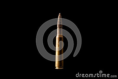 Large bullet isolated on black background. Stock Photo