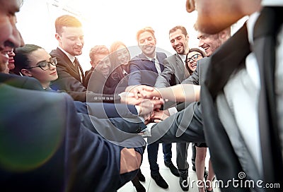 Large business team showing unity with their hands together Stock Photo
