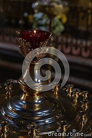 A large candle holder with a lamp in an Orthodox church Stock Photo