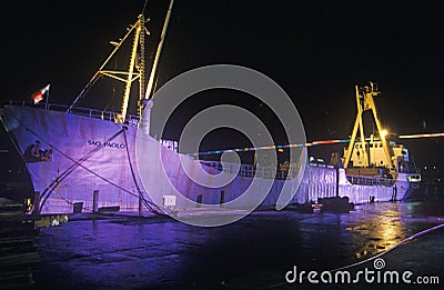 A large cargo ship, the Sao Paolo, lit up at night in a Miami, Florida harbor Editorial Stock Photo