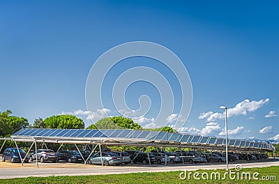 Large carpark with solar panels on the roof to charge cars with ecological, renewable energy Stock Photo