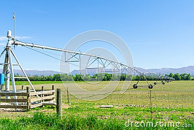 Large center pivot irrigation system running on a farm in Canterbury, New Zealand Stock Photo