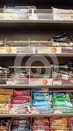 Large choice of protein bars in a grocery store. Editorial Stock Photo