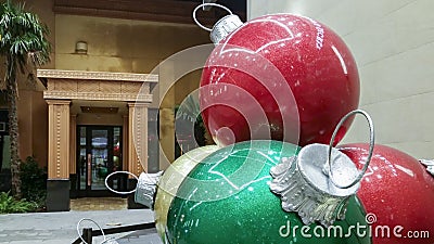 Large Christmas baubles of different colors on display Editorial Stock Photo