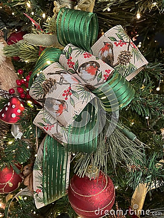 Large Christmas bow made with woodland and green ribbon Stock Photo