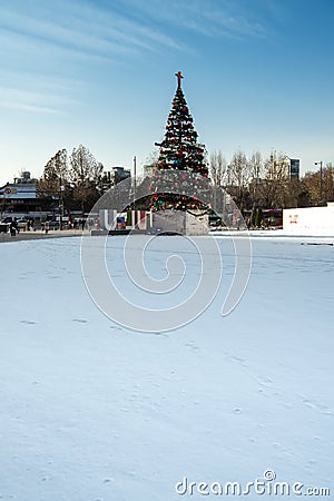 Large Christmas/New Years tree and Ice skating rink in front of Seoul City Hall Editorial Stock Photo