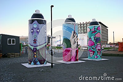 Public city street art of giant painted spray cans with colorful painting, mural, graffiti in Christchurch, New Zealand Editorial Stock Photo