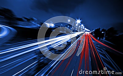 Large city road night scene, night car rainbow light trails Stock Photo