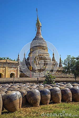 Large clay pots stacked at the Buddhist temple of Hsu Taung Pyi. Old Bagan, Myanmar (Burma) Stock Photo