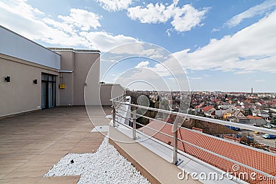 Large clean balcony with tiles and stones city view from the balcony Stock Photo
