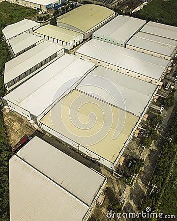 A large cluster of expansive warehouses on former farmland property. Industrial zone in Santo Tomas, Batangas Stock Photo