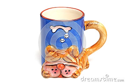 A large coffee mug with a sleeping bulldog mold shape design Stock Photo