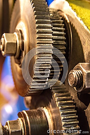 Large cog wheels in the motor Gear box of mechanism in a factory Stock Photo