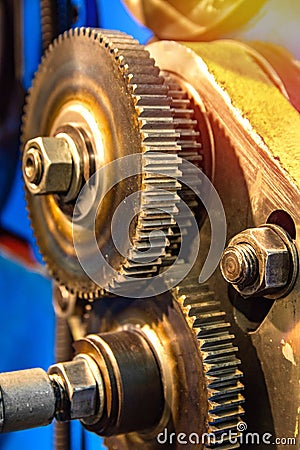 Large cog wheels in the motor Gear box of mechanism in a factory Stock Photo