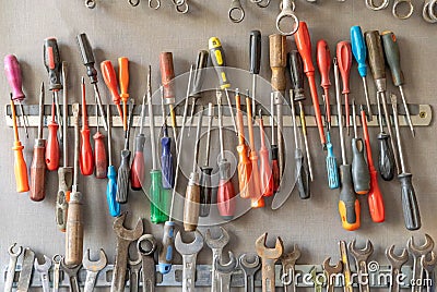 Large colorful set of old wrenches and screwdriver in the DIY workshop Stock Photo