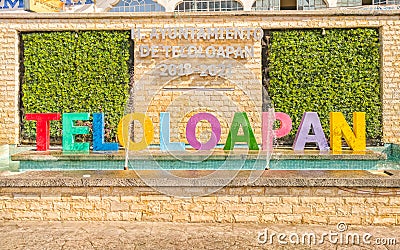 A large colorful sign that reads `Teloloapan` in Guerrero, Mexico. Editorial Stock Photo