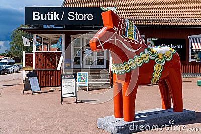 Large colorful Swedish wooden Dala horse outside of a souvenir shop in northern Sweden Editorial Stock Photo