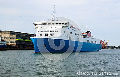 Large commercial freighter in a harbor Stock Photo