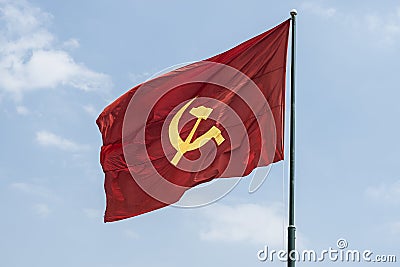 Large communist flag floating in the wind Stock Photo