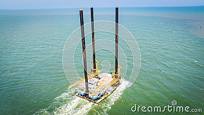 Large construction barge in a body of water. Texas coast, Port Aransas, Corpus Christi Channel Editorial Stock Photo