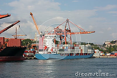 Large container ship in a dock at port Stock Photo