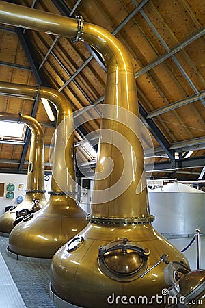 Large copper pot stills in a distillery Stock Photo