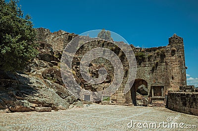 Large courtyard and open gateway on stone wall Stock Photo