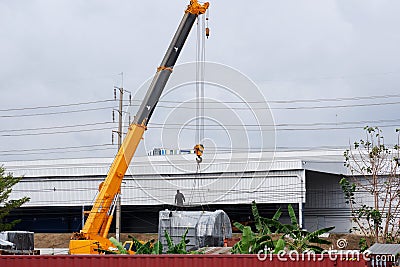 Large crane in the harbor The crane will carry a large amount of material. Crane work in the harbor Stock Photo