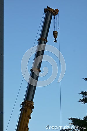 A large crane towering in a building Stock Photo
