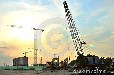 Large crawler crane or dragline excavator with a heavy metal wrecking ball on a steel cable. Stock Photo