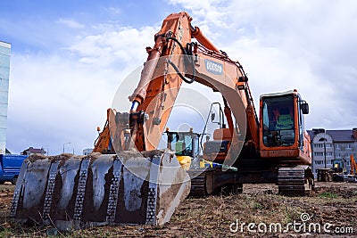 large crawler excavators standing at a construction site Stock Photo