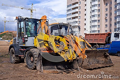 large crawler excavators standing at a construction site Stock Photo