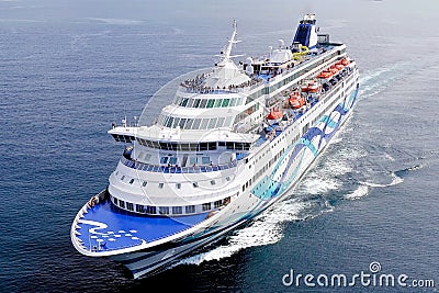 Large Cruise Ship roaring across the open Sea. Editorial Stock Photo