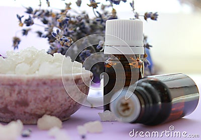 Large crystals of sea salt and jars of essential oils.Aromatherapy and Spa treatments, bathing, relaxation Stock Photo