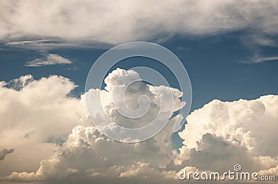 Large cumulous clouds fill the blue sky in Colorado Stock Photo