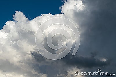 Large Cumulus clouds and dark rain clouds. Stock Photo
