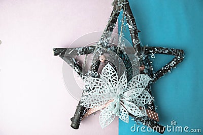 Large decorative beautiful wooden Christmas star, a self-made advent wreath fir branches and sticks on the festive New Year happy Stock Photo