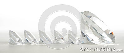 Large diamond leading small ones Stock Photo