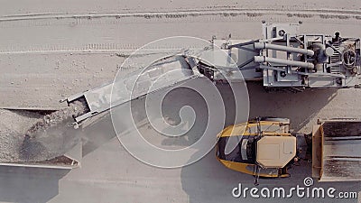 Large excavator in a lignite coal mine. Loading coal into truck. Mining car machinery to transport coal. Open pit mine Stock Photo