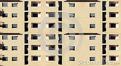 Large facade of a residential building, viewed from the front, with repeating patterns of architecture Stock Photo