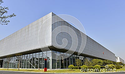 Large factory building ,Large modern building,Large modern exhibition hall,under blue sky,great building Stock Photo