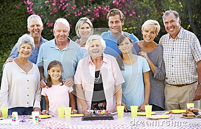 Large Family Group Celebrating Birthday Outdoors Stock Photo