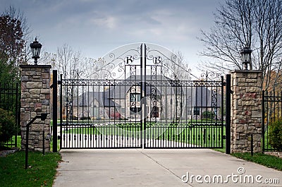 Large fancy mansion behind a gated entry Stock Photo