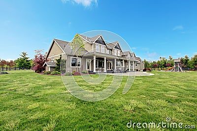 Large farm country house with spring green landscape. Stock Photo