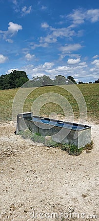 Large farm livestock water trough. Stock Photo