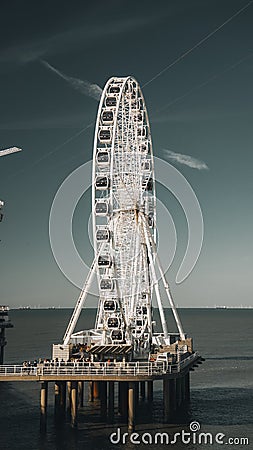 Large Ferris wheel situated at the waterfront in Den Hague, Netherlands Editorial Stock Photo