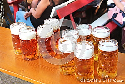 Large filled beer mugs on a table Stock Photo