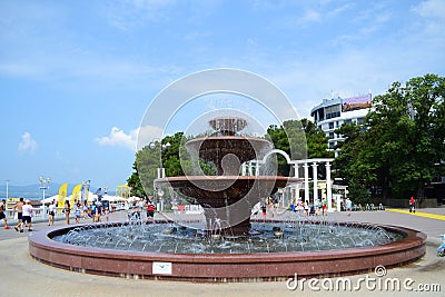 A large fountain in the square in a resort town on a sunny day. Editorial Stock Photo